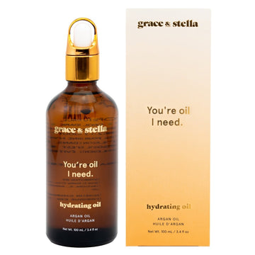 A bottle of grace & stella hydrating argan oil with packaging featuring a pun, "you're oil I need.