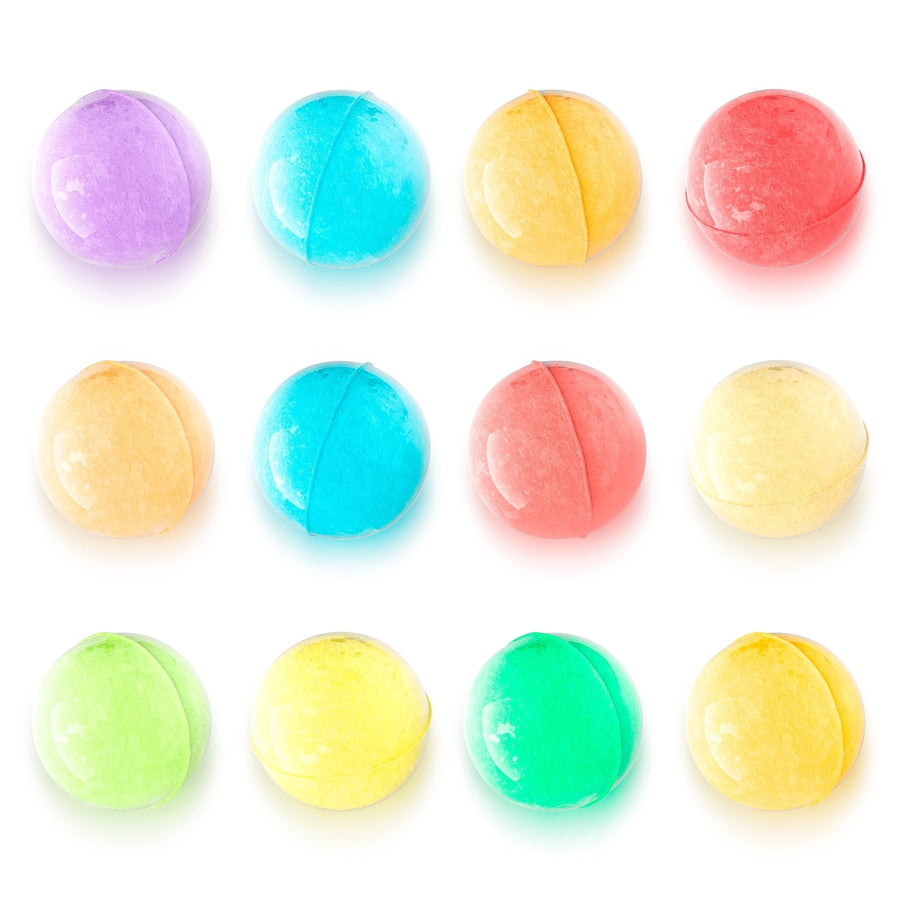 Assorted colorful grace & stella spa-quality bath bombs arranged in a grid on a white background.