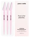 Three pink facial dermaplaning tools by grace & stella, designed for peach fuzz and facial exfoliation, come with the slogan "fuzz is for peaches.