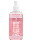 Transparent bottle with grace & stella pink rose spray liquid and a white spray nozzle.