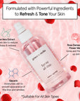 Bottle of facial toner with aloe vera and anti-inflammatory grace & stella rose spray ingredients, positioned against a pink, heart-patterned background, advertised as suitable for all skin types.