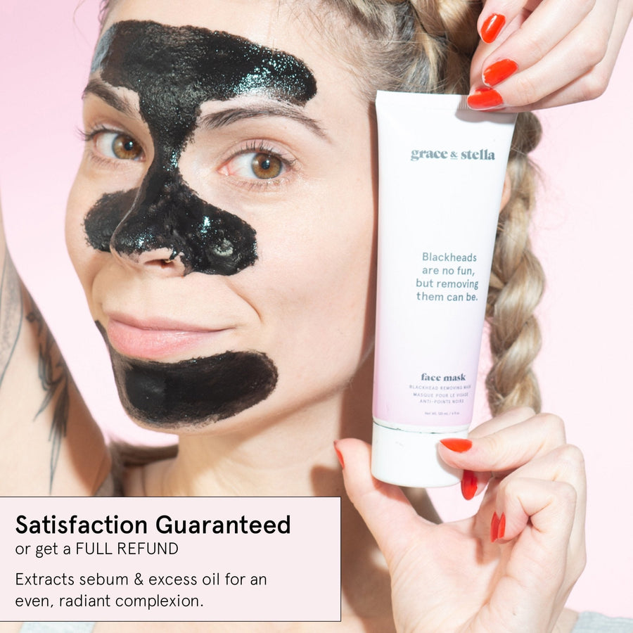 Woman applying a grace & stella blackhead removal peel-off mask to remove blackheads while holding the product tube.