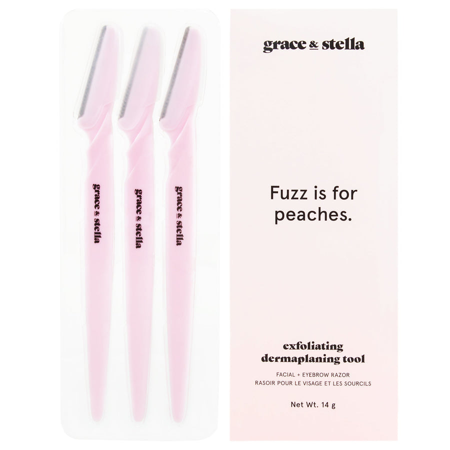 Three pink facial dermaplaning tools by grace & stella, designed for peach fuzz and facial exfoliation, come with the slogan "fuzz is for peaches.