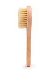A grace & stella dry brush free gift for dry brushing skin on a white background.
