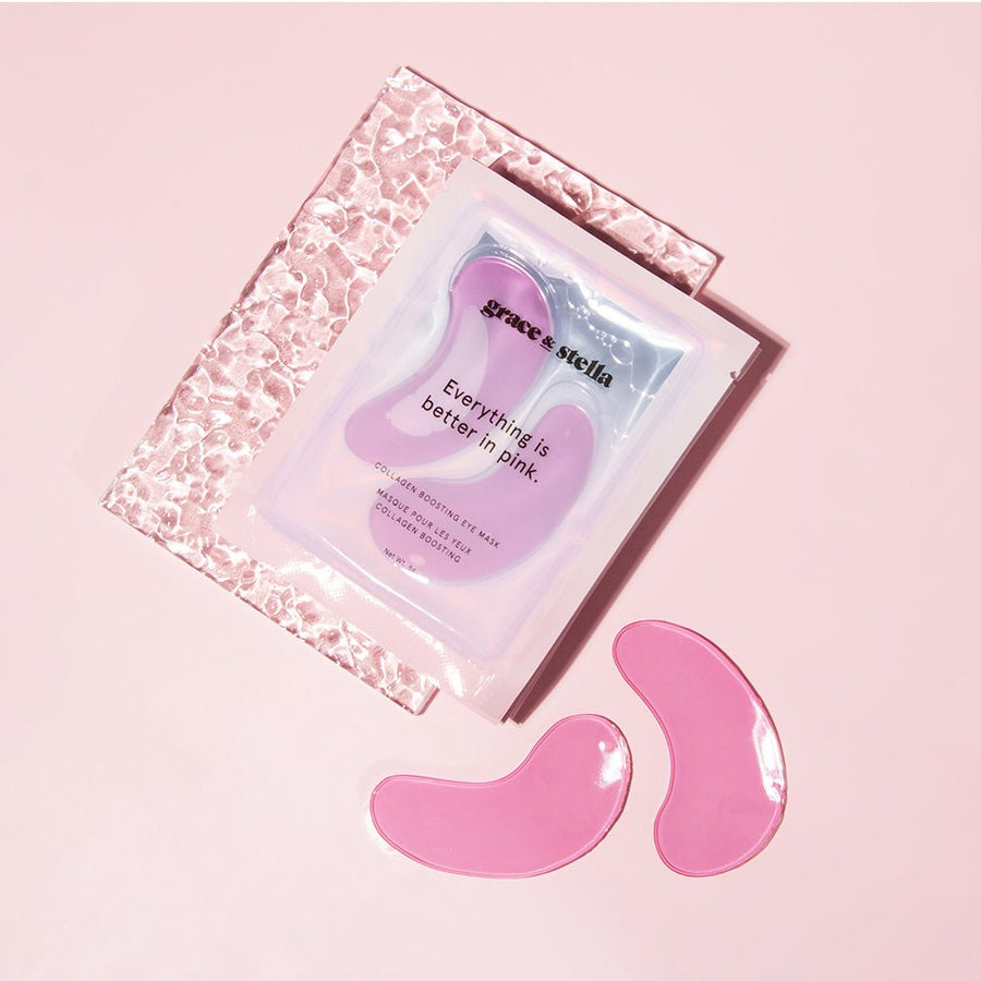 Two grace & stella pink firming hydrogel eye masks beside their packaging on a pastel background.