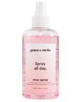 Bottle of grace & stella anti-inflammatory rose spray facial mist with pink liquid.